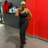Woman wearing black Sculpt Mint strappy athleisure two-piece gym outfit at fitness studio in South Africa