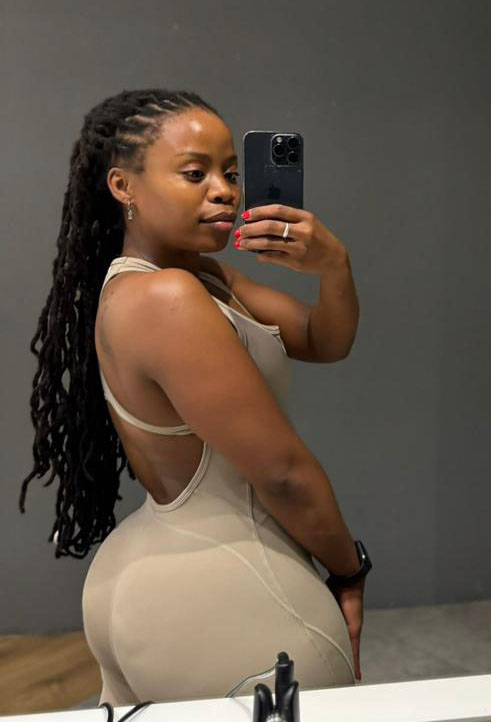 Close-up of the open-back detail on the Mint Flow Suit, highlighting the breathable design and glute contouring.