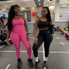 Comparison of the Sculpt Mint Strappy Gym Set in Fuchsia Pink and Classic Black on different body types. Showcasing high-waisted compression leggings and supportive strappy tops in a professional gym setting. Ideal for inclusive fitness fashion in South Africa.